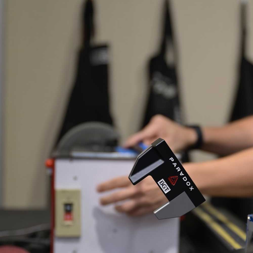 BGT Paradox Mallet Putter held by a person with a blurred background